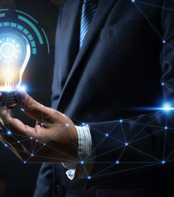 Innovation and energy of creative thinking, businessman holding light light bulb glowing and lighting with connection to human body and power life